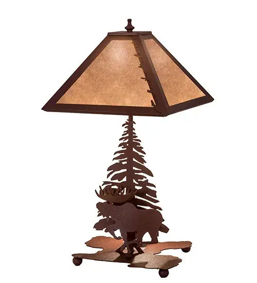 A linear square shade with a leaf edge sits above a lamp base that depicts a running Moose in front of a tall pine. The table lamp is finished in Natural Rust, has Silver mica panels and is handcrafted in the USA by Meyda artisans. Collection: Moose On The Loose Finish: Rust Rust Glass: Silver Mica Width: 11.00" Height: 21.00" Length: 11.00" Weight: 3.00 lb Extension from Wall: 8.50" Number of Bulbs: 2 Maximum Wattage: 100.00 W Bulb Base: Medium Material: Metal Or Polyresin Country of Origin: USA Safety Listing: Dry Safety Rating: Dry - alternate view