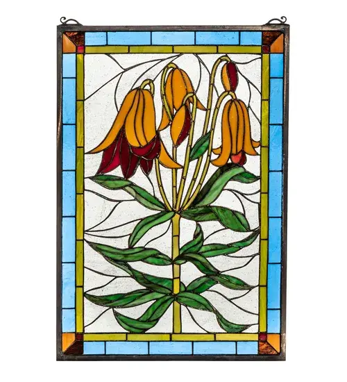 Gracefully Trumpet Lilies with Bronzed Green leaves bow their Dark Orange heads against a Clear Blue sky. This Meyda Tiffany original window is handcrafted utilizing the copperfoil construction process and 219 pieces of stained art glass encased in a solid brass frame. Mounting bracket and jack chain included. - alternate view