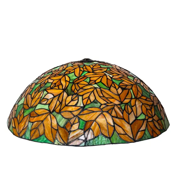 Autumn Brown Branches and Beige Leaves flourish in stunning stained glass on a Leaf Green background; highlighting this spectacular foliage artistry. This stunning Tiffany-style shade is handcrafted using the famous Meyda Tiffany copperfoil construction method. This gorgeous shade pairs well with a base or hardware to create a beautiful lamp; wall sconce; or ceiling fixture to complement the interiors of timber frame homes; camps; and restaurant settings. The fixture is inspired by trees in the Monongahela Forest in West Virginia; the Shawnee National Forest in Illinois; and the Bridger-Teton Forest in Wyoming. The Branches & Autumn Leaf Shade is included in our American-designed; handcrafted Nature Inspired Collection. Upstate New York's adventurous playland; known as the Adirondack Mountains; with its many breathtaking forests; lakes; and rivers; is the spiritual birthplace of Meyda and inspires our rustic-themed stained glass collections.