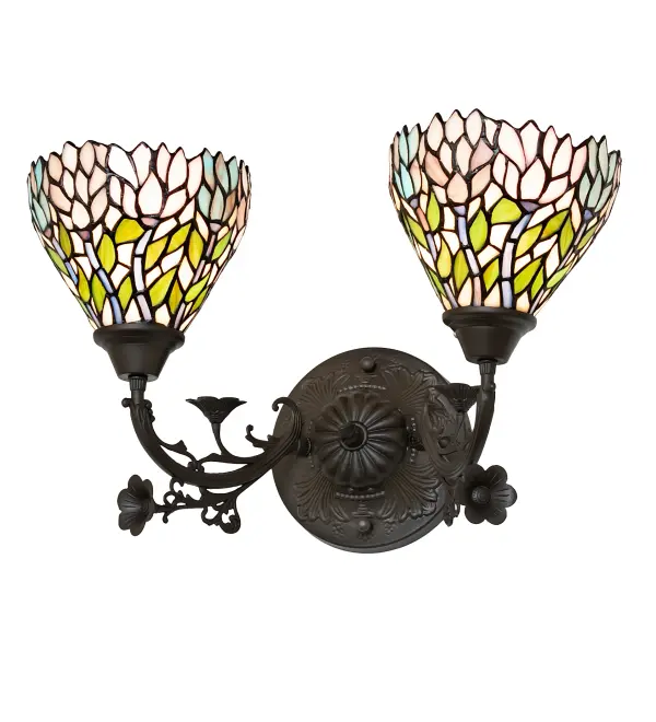 Stylized Wisteria flower clusters in Petal Pink; Amethyst Blue and Dark Mauve with Jade Green leaves and Dark Mauve vines drape over the Beige background of the shades of this wall sconce. The classic styling of Tiffany art glass and soft pastel colors will add charm to any room. The 2 stunning shades are made of hand-cut glass using the famous Meyda Tiffany copperfoil construction technique. This wall fixture is complemented with elegant cast metal hardware in a warm Mahogany Bronze finish. The Wisteria 2- Light Wall Sconce is featured in our American-designed; handcrafted Stained Glass Lighting Collection. UL and cUL listed for dry and damp locations. Each shade is a unique work of art with color variations based on natural ingredients inherent in the glass.