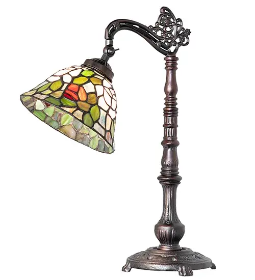 The most beloved of all floral beauties. The Rosebush is beautifully represented in this stunning reproduction of a Tiffany Studio Classic. Petal Pink; Romantic Red; and Beautiful Blue art glass Roses ramble on a maze of Garden Green leaves. The luxurious shade is created using the famous Meyda Tiffany copperfoil construction and paired with an elegant cast metal bridge arm base featured in a Mahogany Bronze finish. Ideal for tables and desks in homes; banks; and libraries from Boston; Massachusetts; to Des Moines; Iowa and Seattle; Washington. The Tiffany Rosebush Bridge Arm Table Lamp is included in our American-designed; handcrafted Tiffany Stained Glass Collection. UL & cUL listed for dry locations. Each shade is a unique work of art with color variations based on natural ingredients inherent in the glass. - alternate view