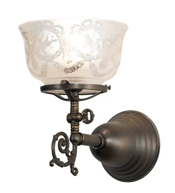 Let the charm and warmth of the past light up your home with this handsome Auburn gas reproduction wall sconce, crafted from brass in the USA by Meyda artisans. The fixture is hand finished in Antique Brass and supports a lovely Wreath and Garland patterned glass shade. Collection: Revival Finish: Antique Brass Glass: Clear & Frosted Glass Width: 7.00" Height: 9.50" Length: 10.00" Weight: 2.00 lb Extension from Wall: 10.00" Number of Bulbs: 1 Maximum Wattage: 60.00 W Bulb Type: A15 Bulb Base: E26 Material: Brass Country of Origin: USA Safety Listing: Damp Safety Rating: Damp