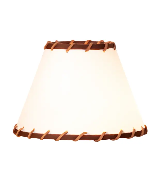 This stunning western-styled shade features a natural Parchment shade created with authentic Rawhide accents. The shade design was inspired by ranches from southwest Texas to northern New Mexico and southern Colorado. Perfect for pairing with sconces and chandeliers to create a rustic aesthetic The Parchment & Rawhide Shade is included in our American-designed; handcrafted Western Lighting Collection.