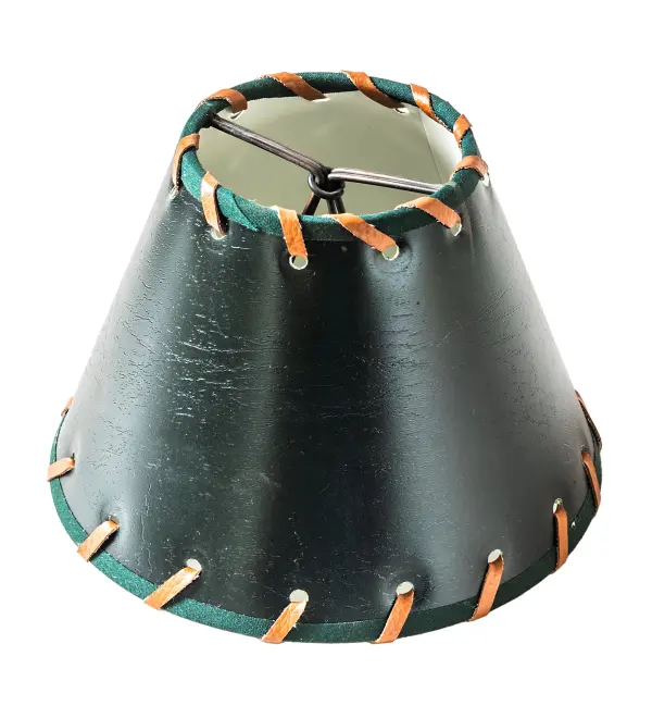 This stunning western-styled shade features a handsome Hunter Green faux Leather shade created with authentic Rawhide accents. This shade pairs well with a base to make a mini lamp or with hardware to build a mini pendant and wall sconce. The Faux Leather & Rawhide Shade is included in our American- designed; handcrafted Western Lighting Collection.