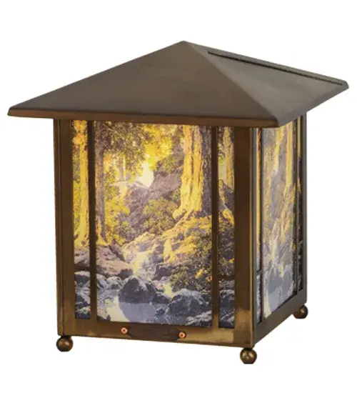 Highlighted in our famed Maxfield Parrish Museum Collection; an exquisite fused image of The Glen is featured on this lovely lantern finished in Antique Copper. Re-creates Maxfield Parrish's techniques and luminescent colors; realism and fantastical imagery. Signed by Meyda Tiffany. Authorized by Maxfield Parrish Foundation. Maxfield Parrish (1870-1966) was one of the best-known and most successful artists of his day. Ideal accent lamp for an occasional table; mantel and other surfaces in the home; restaurants and commercial spaces.