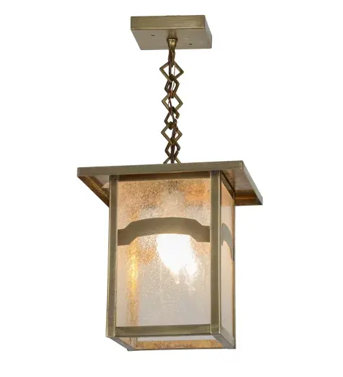 Handcrafted of Solid Brass; an abstract mountainside design comes to light with this Craftsman Signature lantern. This striking fixture features a Clear Seeded Glass diffuser with hardware featured in a Natural Brass finish. Ideal for indoor and outdoor applications. Made in the USA. Handcrafted by Meyda artisans in our Yorkville; New York manufacturing facility at the foothills of the Adirondack Mountains. - alternate view