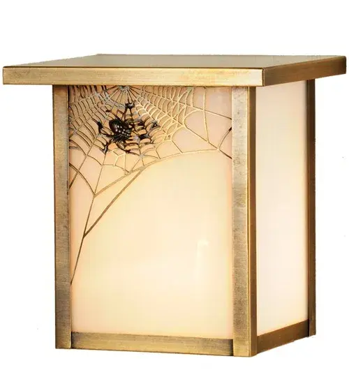 A Spider weaves it's magical web on the edge of this handsome American Craftsman lantern style wall sconce. The fixture, handcrafted in the USA by Meyda artisans, has an Antique finish and has White glass panels. Collection: Hyde Park Finish: Antique Brass Glass: White Art Glass Width: 8.00" Height: 8.00" Length: 6.00" Extension from Wall: 6.00" Number of Bulbs: 1 Maximum Wattage: 60.00 W Bulb Type: A19 Bulb Base: E26 Material: Brass Country of Origin: USA Safety Rating: Wet