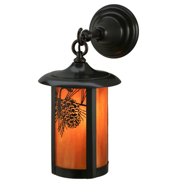Handcrafted from Solid Brass with alluring rustic beauty. This stunning Craftsman Signature lantern features a stunning Pinecone and Pine Needle design on a Honey Amber Glass diffuser that is enhanced with a Craftsman Brown finish. Display this wall sconce to illuminate the exterior of timber homes; modern farmhouses; and other spaces. The Fulton Prime Wall Sconce is featured in our American-made; American-designed; handcrafted Craftsman Signature Series; which is manufactured in Yorkville; New York. UL and cUL listed for dry; damp and wet locations. Our Build Your Own Craftsman Signature Series features unlimited combinations of styles. The collection is called Build Your Own because it is fully configurable and customizable from size and design to finish and lens color. Marine grade; solid brass; or copper raw materials are utilized to ensure items from the Craftsman Signature Series of outdoor and indoor lighting will stand the test of time; as these premium metals are impervious to most types of oxidation. Hand-applied Patina finishes on brass and copper are sealed with a clear varnish and; over time; may require gentle maintenance; such as wax; to delay or reverse the natural living finish attributes indicative of this finishing process. Patina finishes on brass and copper provide strong resistance to fading from sun exposure; will not chip or crack; and will not rust like a steel-framed item in the same conditions. Mica is less durable in outdoor locations but may be appropriate for mildly exposed areas. Choose from many style options; or send us your concept today! Call today to learn how to use the configuration tool available on our website for an instant item number!