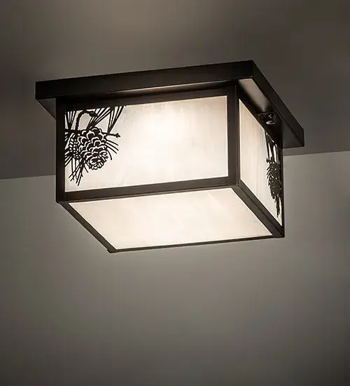 With pinecones and pine needles delicately etched with Solid Brass; this compelling design represents the iconic symbol of spiritual enlightenment and eternal life. Natural charm comes alive with beautiful ambient light shining through White art glass; enhanced by Craftsman Brown finished accents and hardware. The Hyde Park Winter Pine Flushmount is featured in our American-made; American-designed; handcrafted Craftsman Signature Lighting Collection. Manufactured in Yorkville; New York. UL and cUL listed for dry; damp; and wet locations.