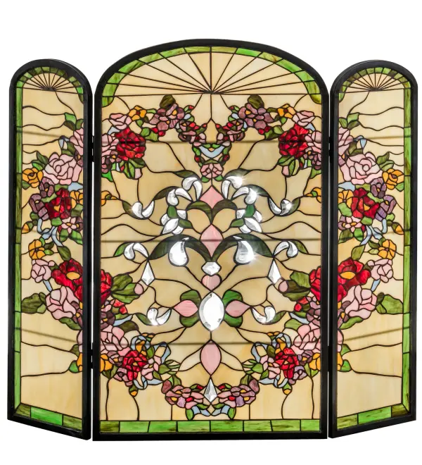 This charming Meyda Tiffany original stained glass firescreen depicts a heart shaped ring of Merlot and Pink roses, Daisy and Violet blossoms, and Willow Green leaves that surround ribbons and scrolls against an Ivory background. The brass frame has a dark hand applied patina. Use this piece of art as an off season fireplace cover or an elegant accent piece in any corner of your home. Collection: Heart Finish: Beige Burgundy Pr Pink Bevels Glass: Ba Br Pr Ja Bevels 59 Width: 40.00" Height: 34.00" Length: 40.00" Weight: 22.00 lb Extension from Wall: 3.50" Number of Bulbs: 1 Bulb Base: E26 Material: Metal Or Polyresin Country of Origin: CHINA Safety Listing: Dry Safety Rating: Dry