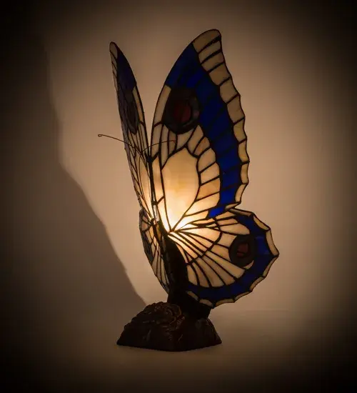 This irresistible Butterfly is hand finished in Mahogany Bronze; and has Plum and Grape colored lighted wings; crafted of copper foil wrapped stained art glass.