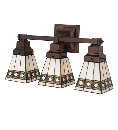 Simple clean lines and geometric shapes are the hallmark of the Mission style. This sleek Bisque Beige stained glass shade features a simple; elegant diamond pattern in Beige accented with Amber; Jade and Peridot borders. The Mission style three light vanity hardware in Mahogany Bronze supports shades that are handcrafted using the same technique as the Louis Comfort Tiffany Studio. - alternate view