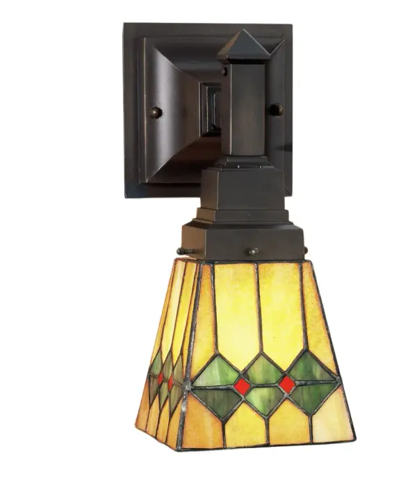 In keeping with the Mission style of translating objects into geometric forms; the Meyda Tiffany design team has taken the martini; complete with olive; and transformed it into this stylish stained glass shade. Olive Green diamonds with Pimento Red accents garnish the Honey Amber wall sconce shade that is suspended from linear Mission styled hardware in Mahogany Bronze. The shade is created using the famous Meyda Tiffany copperfoil construction process. UL and cUL listed for dry and damp locations.