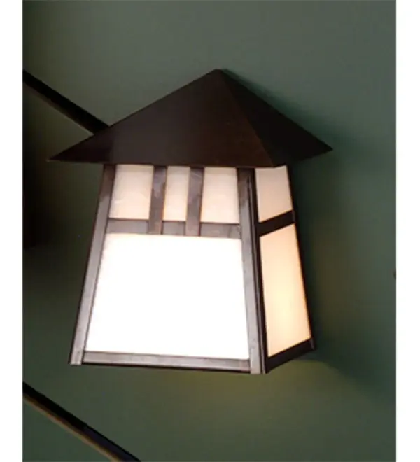 Custom made from Solid Brass. A stunning Craftsman design statement is created with a dramatic Mission-styled straight-line design and highlighted with a Beige art glass shade and a Craftsman Brown finish. This handsome wall sconce is constructed for interior and exterior applications. The fixture can be mounted to walls while providing beautiful ambient lighting in timber homes; modern farmhouses; and other spaces from Traverse City; Michigan; to Lake Tahoe; Nevada; to Lake Geneva; Wisconsin. The Stillwater Double Bar Mission Wall Sconce is included in our American-made; American-designed; handcrafted Craftsman Signature Series and manufactured in Yorkville; New York. UL and cUL listed for dry; damp; and wet locations. Our Build Your Own Craftsman Signature Series features unlimited combinations of styles; functions; sizes; and finishes. Options include lanterns; pier and post mounts; and deck lights crafted of marine-grade materials like brass and copper with timeless living finishes offered to endure harsh climates.