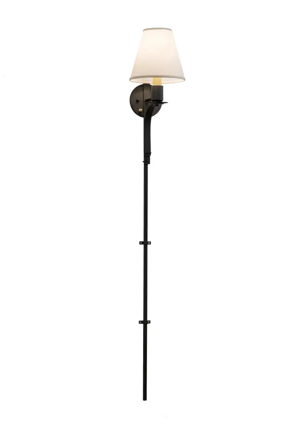 Exquisite styling and luxurious charm are revealed in this minimalist Minaret wall sconce. This elegant sconce embraces an Amber-colored faux candlelight topped with a Beige fabric shade and complemented with a backplate; hardware and a very extensive stem that embraces both the wall and floor; in a Wrought Iron finish.The fixture features quality materials and hand detailed American craftsmanship perfected by years of time honored artistry; passed down from generations of prolific artisans.Custom sizes; styles; colors and dimmable energy efficient lamping options are available.The fixture is UL and cUL listed for damp and dry locations.A matching Minaret Right Wall Sconce (48555) is also available to complete the set; for design continuity.