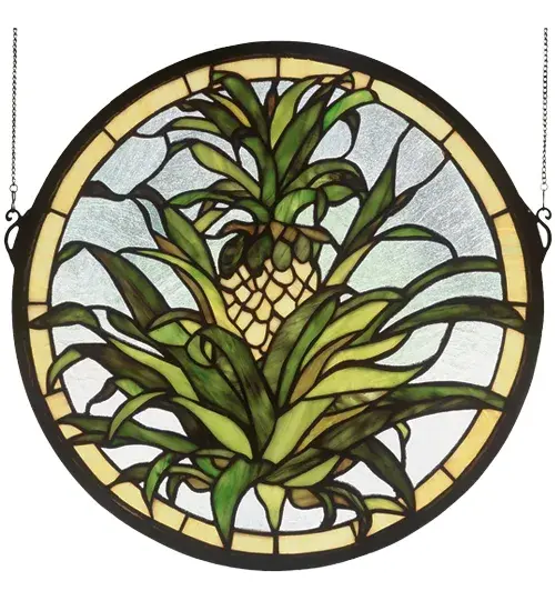 The pineapple; a traditional sign of welcome; is depicted in this Meyda Tiffany original window of Honey Gold fruit with Tropical Green foliage on a Clear seedy background. Handcrafted utilizing the copperfoil construction process and more than 210 pieces of stained art glass encased in a solid brass frame. Mounting bracket and jack chain included.
