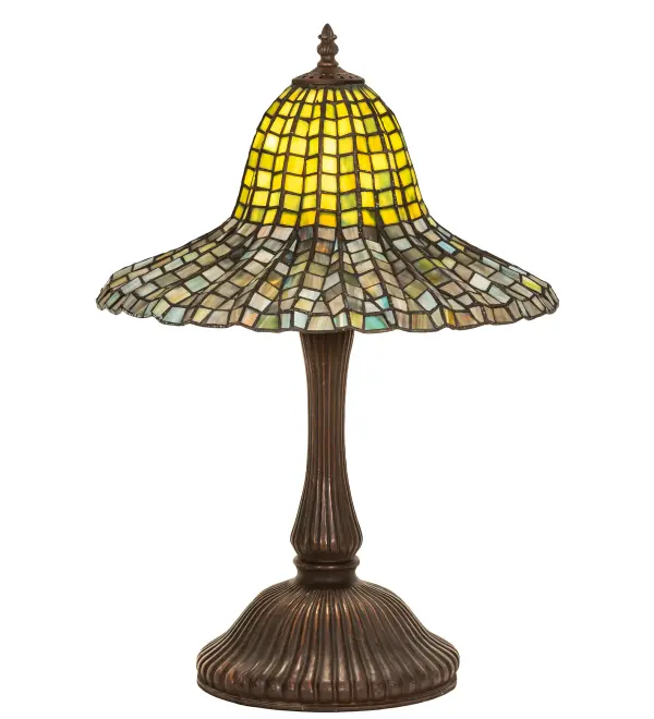 Recreating a luxurious Tiffany original is the beautiful; Bell-shaped art glass shade decorated with a cascading geometric design and Green; Blue; and Honey hued glass tiles. The art glass shade is created with the famous Meyda Tiffany copperfoil construction technique. The shade is complemented with an elegant cast metal base hand-finished in a warm Mahogany Bronze. The Bell Shade is included in our American-designed; handcrafted Tiffany Reproduction Collection. UL and cUL listed for dry locations. Each shade is a unique work of art with color variations based on natural ingredients inherent in the glass. Please contact us if color matching is critical when ordering multiple items.