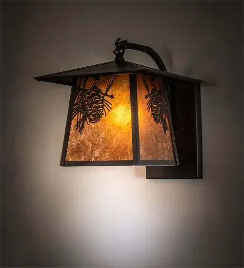 Pine Cone laden branches accent this handsome American Craftsman lantern style curved arm wall sconce. The fixture; handcrafted in the USA by Meyda artisans; is finished in Craftsman Brown and has Amber mica panels.