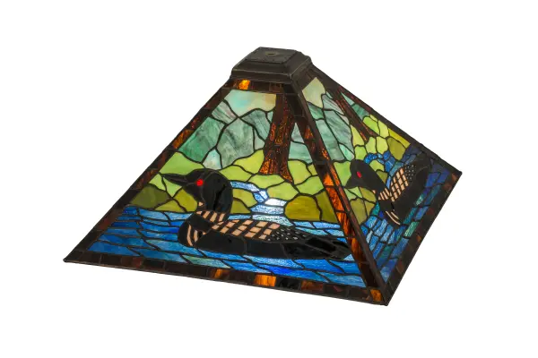 A stunning image of this aquatic bird floating on a lake near the woodlands is captured in Blue Stained Glass against a landscape of various Green colors with a Bark Brown Stained Glass tree to complement the shade's border. This wildlife-inspired shade was created using the famous Meyda copper foil construction process. The shade can be paired with a base to create a table lamp or hardware to build a ceiling fixture. The lighting design is inspired by Loons from the Great Lakes region to the Florida coasts; to Alaska's Aleutian Islands. The Loon Shade is included in our American-designed; handcrafted Wildlife Collection.