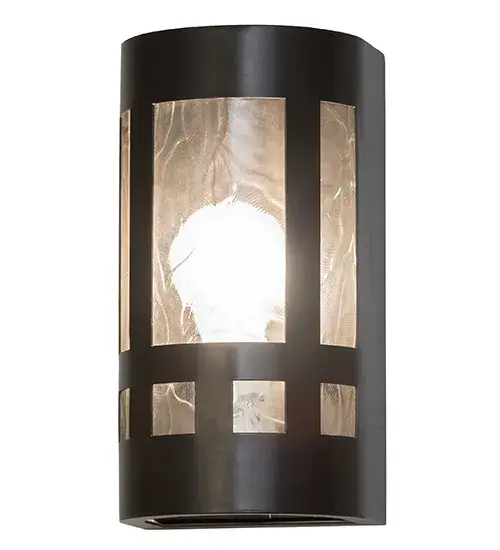 Created in the tradition of American master craftsmen, this uniquely designed wall sconce features a stunning Clear Leaf Glass lens set within a Timeless Bronze finished frame. The ADA-compliant fixture is ideal for illuminating hallways, entryways, and other spaces in residential and hospitality settings. The Sutter Wall Sconce is featured in our American-made, American-designed handcrafted Arts & Crafts Lighting Collection. UL and cUL listed for dry and damp locations. Collection: Sutter Finish: Timeless Bronze Glass: Clear Leaf Glass Notes: Custom Crafted In Yorkville, New York Please Allow 30 Days Width: 5.00" Height: 9.50" Length: 4.00" Weight: 3.50 lb Extension from Wall: 4.00" Number of Bulbs: 1 Maximum Wattage: 60.00 W Bulb Base: E26 Material: Steel Country of Origin: USA Safety Listing: Dry Safety Rating: Damp - alternate view