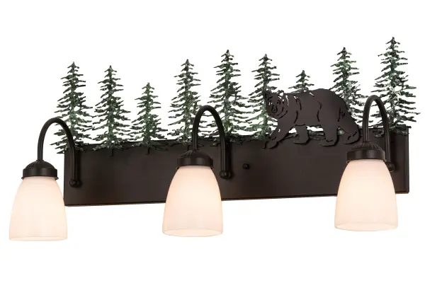 Drawing inspiration from the wildlife and natural beauty in the nearby Adirondack Mountains, this stunning lighting fixture depicts a majestic Bear wandering around the woodlands with a stand of tall pine trees in the background.Three White art glass shades project downward illumination and are complemented with a frame and hardware featured in a Textured Black finish and enhanced with handpainted Green Tree decorative accents. The fixture is ideal for illuminating baths as a vanity light or as a wall sconce in corridors and other rooms.The luminaire is handcrafted by skilled artisans in our Yorkville, NY facility. Custom designs, finishes, sizes and dimmable energy efficient lamping available. UL & cUL listed for dry and damp locations. Collection: Lone Bear Finish: Textured Black/Green Trees Glass: White Opal Glass Notes: Custom Crafted In Yorkville, New York Please Allow 30 Days Width: 27.00" Height: 13.25" Length: 8.00" Weight: 6.00 lb Extension from Wall: 8.00" Number of Bulbs: 3 Maximum Wattage: 60.00 W Bulb Type: A15 Bulb Base: E26 Material: Steel Country of Origin: USA Safety Listing: Damp Safety Rating: Damp