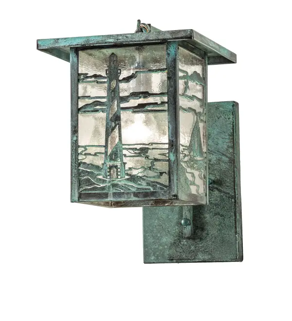 A steadfast Lighthouse stands watch at the edge of the sea on this handsome American Craftsman lantern style curved arm wall sconce. The fixture; handcrafted in the USA by Meyda artisans; is finished in Verdigris and has Clear Seedy glass panels.