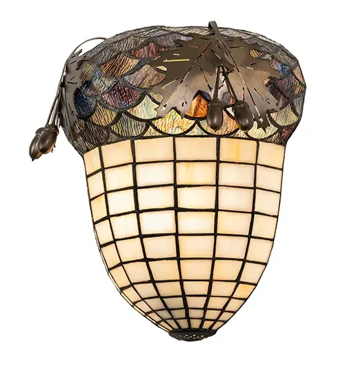Majestic as the mighty oak is this leaf adorned wall sconce in an Antique Copper finish. The lighted stained glass acorn features Ivory glass. The diffuser is topped with a Multi-toned Blue and Green granite glass crown sprouting oak leaf covered hardware that is handmade by Meyda artisans in our 180,000 square foot manufacturing facility in Yorkville, New York. Diffuser colors, metal finishes and sizes can be customized. UL and cUL listed for dry and damp locations. Collection: Oak Leaf & Acorn Finish: Antique Copper Glass: Stained Glass Width: 12.00" Height: 13.00" Length: 6.00" Weight: 5.50 lb Extension from Wall: 6.00" Number of Bulbs: 1 Maximum Wattage: 60.00 W Bulb Type: A19 Bulb Base: E26 Material: Steel Country of Origin: USA Safety Listing: Damp Safety Rating: Damp - alternate view