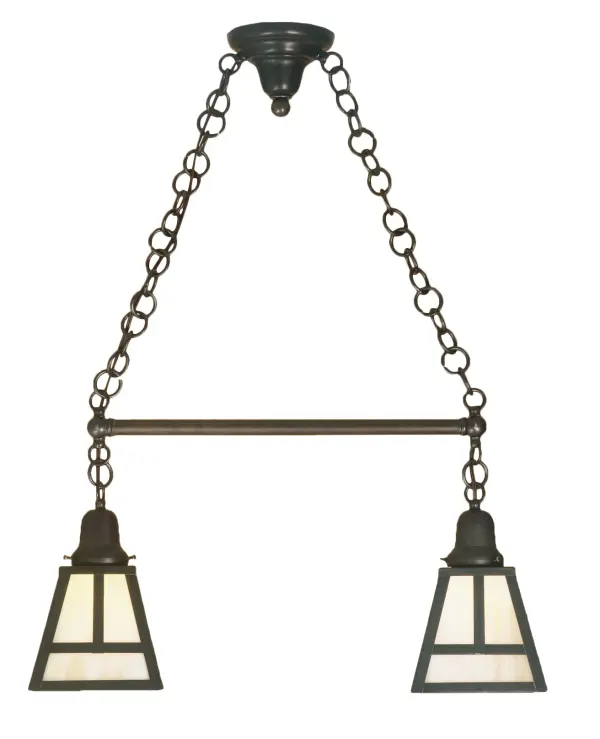 This handsome Craftsman styled Pendant is inspired by the Arts and Crafts movement. This fixture features 2 Beige Iridescent art glass shades with a striking Mission straight line design and complemented with Solid Brass hardware and decorative accents highlighted in a Craftsman Brown finish. The fixture is perfect for a broad range of interior lighting applications including illuminating islands; counters; and tables. The pendant is handcrafted by highly skilled artisans in our 180;000 square foot manufacturing facility in Yorkville; New York. Custom sizes; styles; colors and dimmable energy efficient lamping options are available. The 26-inch long fixture is UL and cUL listed for dry and damp locations.