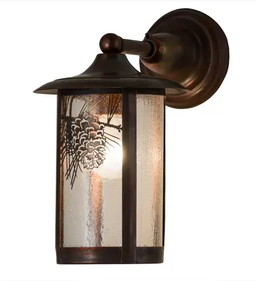 Custom crafted of Solid Brass, this Craftsman Signature wall sconce features Clear Seedy Glass shade enhanced with Pinecone and Pine Needle decorative accents, frame and hardware featured in a Vintage finish. Perfect for indoor and outdoor applications, this cylindrical shaped wall fixture is available in custom finishes, sizes, styles and dimmable energy efficient lamping options. The fixture is UL and cUL listed for dry and wet locations. Collection: Fulton Finish: Vintage Copper Glass: Clear Seeded Glass Width: 8.00" Height: 13.00" Length: 12.00" Weight: 4.00 lb Extension from Wall: 12.00" Number of Bulbs: 1 Maximum Wattage: 60.00 W Bulb Type: A19 Bulb Base: E26 Material: Steel Country of Origin: USA Safety Listing: Wet Safety Rating: Wet - alternate view