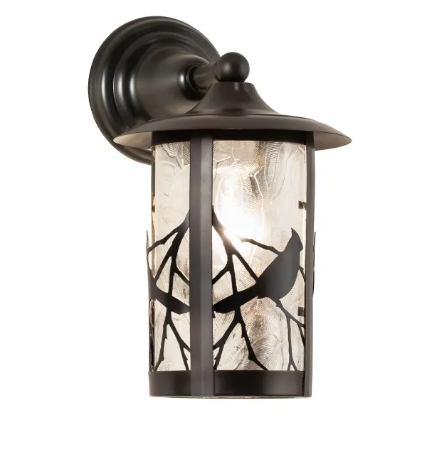 Branches with Song Bird silhouettes accent this handsome American Craftsman lantern style solid mount wall sconce. The fixture, handcrafted in the USA by Meyda artisans, is finished in Craftsman Brown and has Clear Leaf pattern glass panels. Collection: Fulton Finish: Clear Leaf Glass: Craftsman Brown On Brass Width: 8.00" Height: 13.50" Length: 11.00" Weight: 4.00 lb Extension from Wall: 11.00" Number of Bulbs: 1 Maximum Wattage: 60.00 W Bulb Type: A19 Bulb Base: E26 Material: Brass Country of Origin: USA Safety Rating: Damp