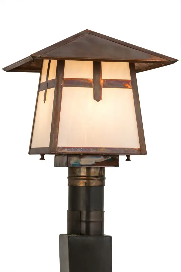 The Cross Mission has Arts and Crafts style crossed bars that accents this handsome American Craftsman lantern style post mount. The fixture, handcrafted in the USA by Meyda artisans, is finished in Vintage Copper and has White glass panels. Collection: Stillwater Finish: Vintage Copper Glass: White Art Glass Width: 17.50" Height: 12.00" Length: 12.00" Weight: 7.50 lb Number of Bulbs: 1 Maximum Wattage: 60.00 W Bulb Type: A19 Bulb Base: E26 Material: Copper Country of Origin: USA Safety Listing: Wet Safety Rating: Wet