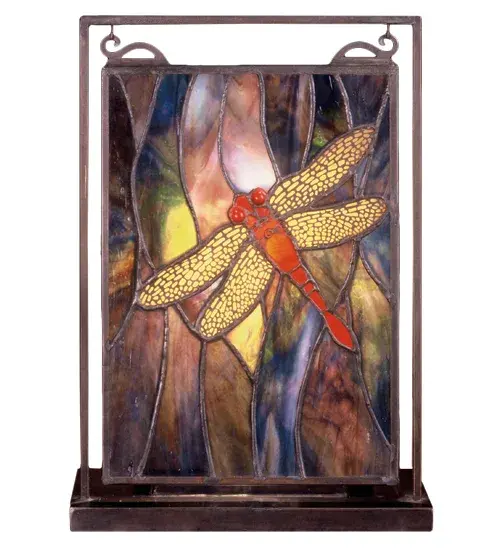 A solitary Scarlet Dragonfly with Ruby eyes and filigree wings dives playfully against a cloud filled Aurora Midnight sky streaked with a full spectrum of colors. The exceptional stained art glass used in this family has unique tones in each piece; just as in nature. Each piece of glass is hand cut and copper foiled in the Tiffany tradition. The window is encased in a solid brass frame and brass mounting bracket and chains are included and hangs perfectly in it's own brass tabletop display.
