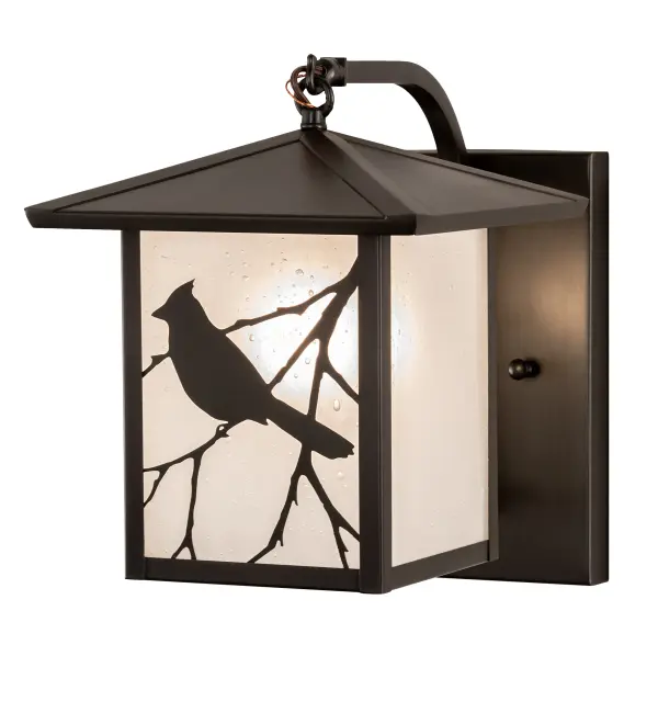 Branches with Song Bird silhouettes accent this handsome American Craftsman lantern style curved arm wall sconce. The fixture; handcrafted in the USA by Meyda artisans; is finished in Craftsman Brown and has Clear Seeded glass panels.