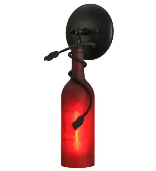 Capture the life of the party with the whimsical design of the Meyda Wine Bottle wall sconce. Liven up a restaurant; club; or home with a wall fixture that does so much more than deliver light; it adds personality and pizzazz. A Textured Black finished wall plate with a Vine-like metal accent embraces a Red Frosted Glass Wine Bottle with an Etched Grapes design. Create a stunning design statement by installing this fixture in corridors and dining areas in homes; restaurants; hotels; pubs; nightclubs; and wineries; connoisseurs will appreciate this luminaire's fine detail and charm. This rich-looking Tuscan Vineyard Etched Grapes Wine Bottle Wall Sconce is included in our American-made; American-designed; handcrafted Wine Bottle Lighting Collection. The fixture is manufactured in Yorkville; New York. UL and cUL listed for dry and damp locations. Take your finest bottle of wine; and Meyda will transform it into an everlasting personalized fixture of light. Contact us for more information on custom wine bottle lighting fixtures and lamps. We can also create custom lighting with beer bottles; mason jars; milk bottles; and other glass containers and vessels. - alternate view