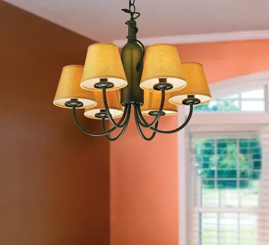 Capture the life of any party with authentic wine bottle lighting... It's so much fun that you may want to hang from this chandelier; but don't. The fixture does so much more than deliver light; it adds personality and pizazz to any interior. It is perfect for homes; restaurants; hotels; pubs; nightclubs; wineries; and fine retailers. The authentic Antique Green Glass Wine Bottle is attached to sturdy hardware and a vine-like metal accent featured in a Textured Black finish. The wine bottle is enhanced with six elegant Parchment shades that crown Ivory faux candlelights. The overall height ranges from 20 to 55 inches; as the chain can be easily adjusted in the field to meet your exact lighting requirements. The Tuscan Vineyard 6 Light Parchment Chandelier is included in our American-made; American-designed; handcrafted Wine Bottle Lighting Collection and manufactured in Yorkville; New York. UL and cUL listed for dry and damp locations; however; we do not recommend placing it in spaces that experience a large amount of moisture due to the parchment shades. - alternate view
