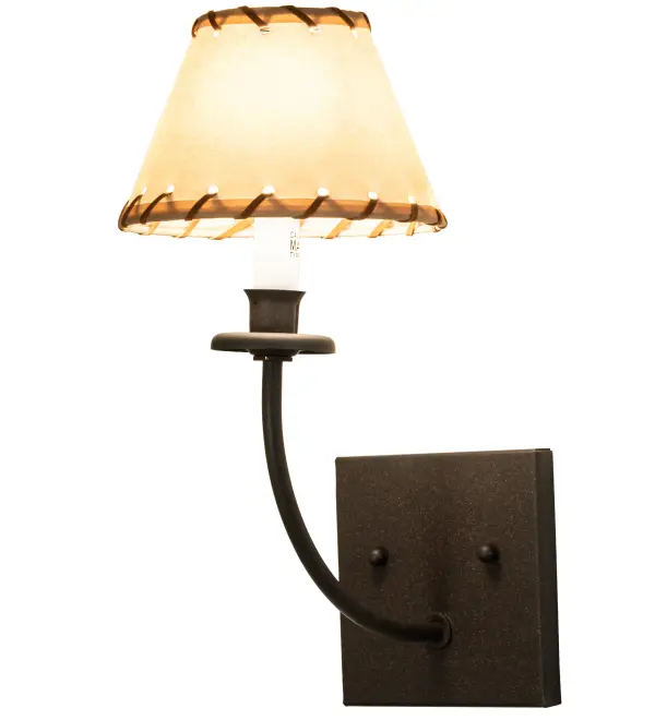 Western rustic charm comes to light. This handcrafted Ranchero wall sconce features a Beige Parchment shade with Leather Stitching. The fixture is illuminated by an Ivory faux candlelight which is embraced by a bobeche. The gracefully curved arm is featured in a Dark Roast finish. Domestically produced in our 180;000 sq ft manufacturing facility in Yorkville; NY. Shade materials; metal finishes and fixture sizes can be customized. UL and cUL listed for dry and damp locations; however we do not recommend installing it in spaces that experience a large amount of moisture due to the fabric shade.