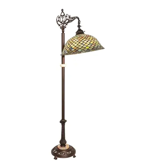 A Louis Comfort Tiffany studio classic fishscale pattern reproduced in variegated glass of Honey dripped Emerald; Sapphire; and Garnet. This handsome stained glass shade is used with a Mahogany Bronze hand finished lamp base. A versatile bridge arm floor lamp to complement any color or style. - alternate view