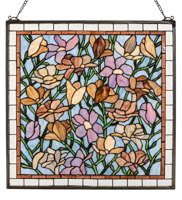 Spring Green branches against an Azure sky are filled with a beautiful array of colorful magnolias in Sugar Blue; Honey; Pink and Violet. Made with 570 pieces of hand cut and copper foiled stained art glass; this Meyda Tiffany original design is a true charmer. A solid brass hanging chain and brackets are included.