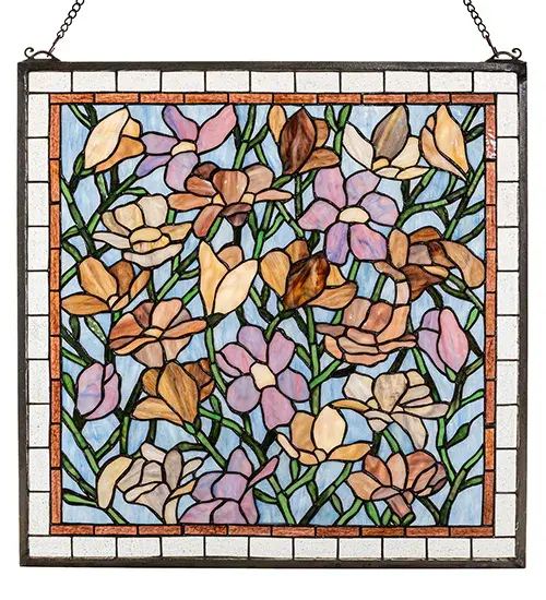 Spring Green branches against an Azure sky are filled with a beautiful array of colorful magnolias in Sugar Blue; Honey; Pink and Violet. Made with 570 pieces of hand cut and copper foiled stained art glass; this Meyda Tiffany original design is a true charmer. A solid brass hanging chain and brackets are included. - alternate view