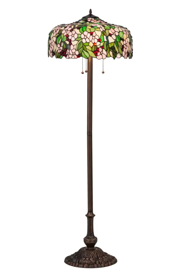 Cardinal Red jewel cherries glisten between Rosy Pink flowers and Verdant Green leaves in our version of the Tiffany Studio's cherry blossom. The cascading blooms and fruit form the undulating edge of this colorful and intricately patterned stained glass shade. This lovely shade rests on a Mahogany Bronze hand finished floor lamp base.