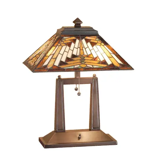 Warm earth toned Bone Beige and Moccasin Tan stained glass; accented with glistening Root Brown and Sage Green; is used to make this intricate interlocking patterned shade. A Mission style lamp base in a hand applied Mahogany Bronze finish supports the handsome rectangular shade inspired by historic American artwork. Handcrafted with the copper foil technique developed by Louis Comfort Tiffany; this oblong table lamp is a true masterpiece.