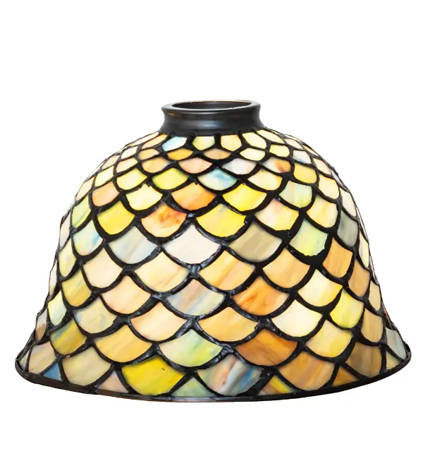 A Louis Comfort Tiffany studio classic... The renowned Fishscale design features a variegated Tortoiseshell of Emerald, Sapphire, Mauve, and Beige colored art glass, evoking a unique dimensional and textured look in a rainbow of brilliant hues. This exquisite art glass shade is created using the famous Meyda Tiffany copperfoil construction process and enhanced with a Mahogany Bronze finish. The lighting design is inspired by Rainbow Trout and other colorful fish found in Northwest Montana, Eastern Idaho, and Baja, California. The shade can be paired with hardware to build a ceiling pendant or wall sconce. See model 29645 shade to create a Mini Tiffany lamp. The Tiffany Fishscale Shade is included in our American-designed, handcrafted Tiffany Reproduction Lighting Collection. Each shade is a unique work of art with color variations based on natural ingredients inherent in the glass. Collection: Tiffany Fishscale Glass: Stained Glass Width: 8.00" Height: 5.50" Length: 8.00" Weight: 1.50 lb Country of Origin: CHINA Safety Rating: Dry