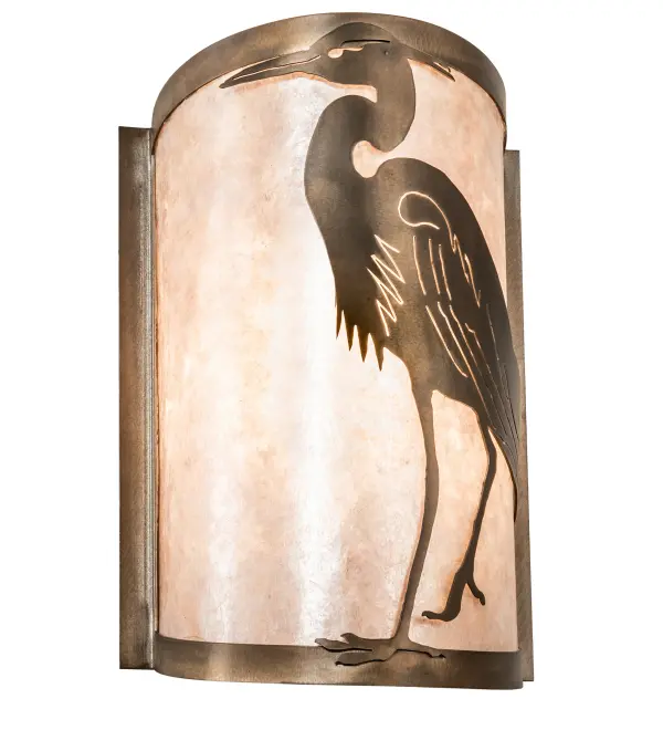 The Heron wall fixture features a long-neck wading bird that stands tall in a solid profile finished in Antique Copper. The design is highlighted on a stunning Silver Mica diffuser that includes a Frosted interior. The Heron is comfortable with one foot on land and one in the water; recognized as maintaining calm; stability and fluidity. This left wall sconce complements item 68186; the right side version of this design. The Heron Wall Sconce is featured in our American made; American designed; handcrafted Outdoor Wildlife Collection. Manufactured in Yorkville; New York. UL and cUL listed for dry and damp locations.