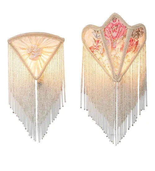 An alluring and beautiful set of night lights. One night light features an Ivory fabric shade with Pink Tulip and Green Leaf damask fabric; and the other features White fabric with a charming White Rose accent. Both are edged in long clear glass beaded trim. The night lights are ideal for illuminating kitchens and baths and were inspired by beautiful fabrics and fashion from New York; to Chicago; Illinois; and Los Angeles; California. The Fabric & Fringe Night Light Set is featured in our American-designed; handcrafted Fabric & Fringe Collection. UL and cUL listed for dry locations. - alternate view