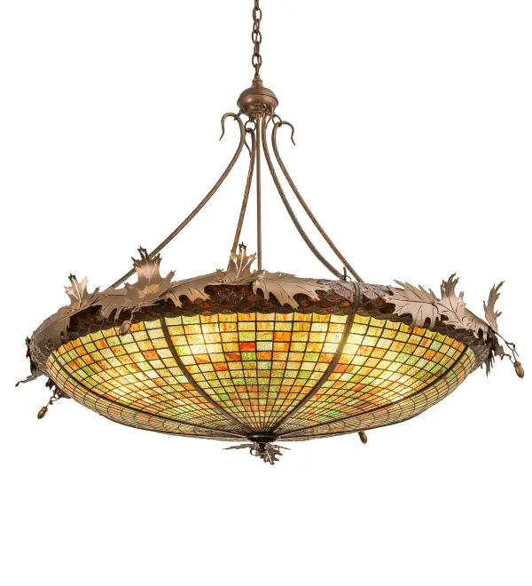 Majestic as the mighty oak; this dramatically styled pendant features an Acorn art glass profile. The inverted stained glass shade delights with Autumnal Beige Art glass; featuring a Bark Brown Glass crown; sprouting Antique Copper finished Oak leaf metal accents and hardware. The shade is created using the famous Meyda Tiffany copper foil construction process. The pendant is ideal for installation in an entryway or dining area; creating a beautiful design statement. The overall height ranges from 43 to 73 inches; as the chain can be easily adjusted on location. The Greenbriar Oak Inverted Pendant is part of our American-made; American-designed; handcrafted Greenbriar Collection. The fixture is UL and cUL listed for dry & damp locations. Each shade is a unique work of art; featuring color variations derived from the natural ingredients inherent in the glass. Please don't hesitate to contact us if color matching is critical when ordering multiple items.