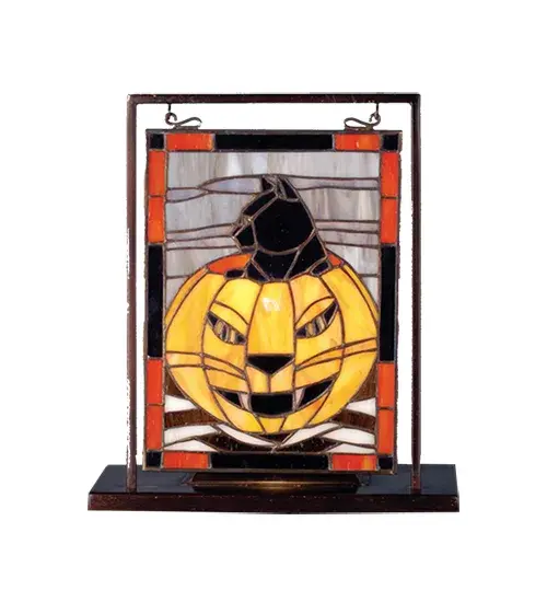 A Pumpkin Orange Jack-o-Lantern sits in front of a Cloud Gray sky; ready to scare up a festive Halloween and Autumn Season. Handcrafted utilizing the famous Meyda Tiffany copperfoil construction process with stained art glass encased in a solid Brass frame. Ideal as an illuminating accent piece on mantels; credenzas; occasional tables; and other spaces in residential and hospitality settings. Inspired by homes from Salem; Massachusetts; to Sleepy Hollow; New York; to Transylvania; Romania. The Halloween Lighted Mini Tabletop Window is included in our American-designed; handcrafted Stained Glass Collection. UL and cUL listed for dry locations.