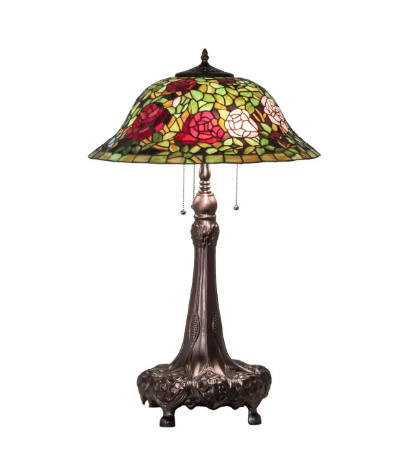 The most beloved of all floral beauties. The Rosebush is beautifully represented in this stunning reproduction of a Tiffany Studio Classic. Petal Pink; Romantic Red and Plum Passion art glass Roses ramble on a maze of Garden Green leaves. The shade is created using the famous Meyda Tiffany copperfoil construction. The delicate domed stained glass shade is paired with a Mahogany Bronze finished lamp base. UL and cUL listed for dry locations.