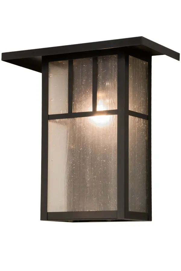 Double T bars adorn this handsome American Craftsman lantern style wall sconce. The fixture; handcrafted in the USA by Meyda artisans; is finished in Craftsman Brown and has Clear Seedy glass panels.