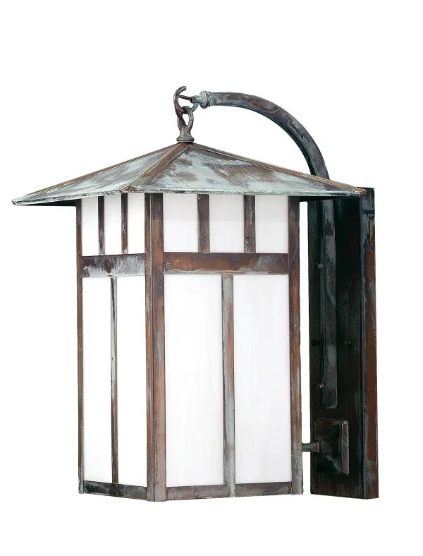 This handsome American Craftsman lantern style curved arm mission style wall sconce is handcrafted in the USA by Meyda artisans; finished in Verdigris and has White art glass panels.