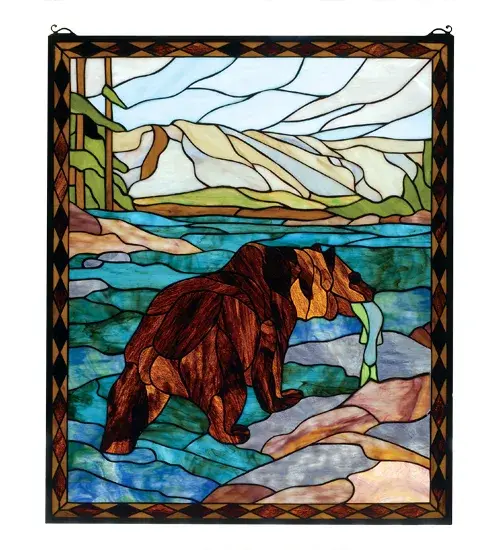 In the sparkling Turquoise river winding through Granite Grey mountains with a stand of Pine Green trees; is a Brown bear with his catch of the day. This picturesque scene is handcrafted of a beautiful selection of stained art glass. The Meyda Tiffany Original window is framed in a rustic Bark and Leather Brown diamond border. Brass mounting bracket and chains are included.